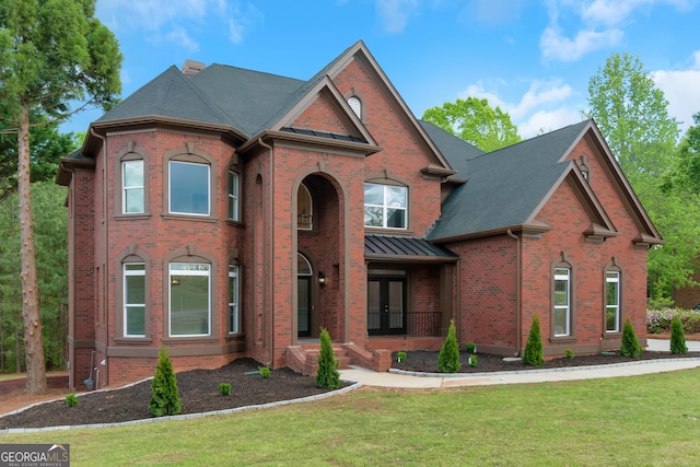 6048 Golf View Xing, Locust Grove, GA 30248 - view of front of home with french doors, a front lawn, and brick siding