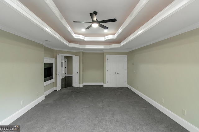 6048 Golf View Xing, Locust Grove, GA 30248 - unfurnished bedroom with a raised ceiling, carpet flooring, ornamental molding, and ceiling fan