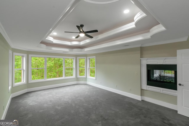6048 Golf View Xing, Locust Grove, GA 30248 - spare room with ornamental molding, a raised ceiling, dark carpet, and ceiling fan