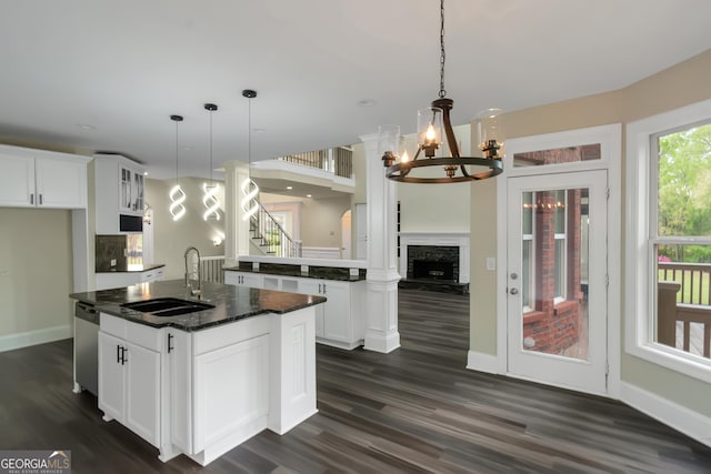 6048 Golf View Xing, Locust Grove, GA 30248 - kitchen featuring a center island with sink, a chandelier, dark wood-style flooring, and stainless steel dishwasher