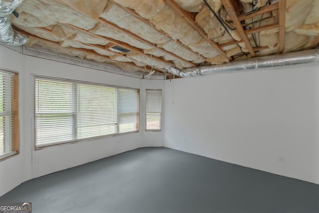 6048 Golf View Xing, Locust Grove, GA 30248 - spare room featuring concrete flooring