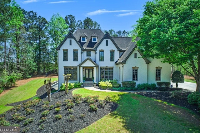 921 Accipiter Way, Ball Ground, GA 30107 - view of front of home with a front lawn, french doors, and stucco siding