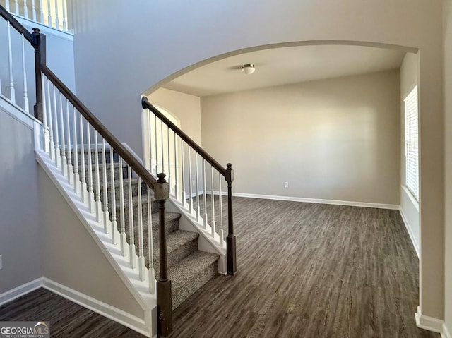 121 Birch River Ct, Dallas, GA 30132 - stairs with baseboards, arched walkways, and wood finished floors