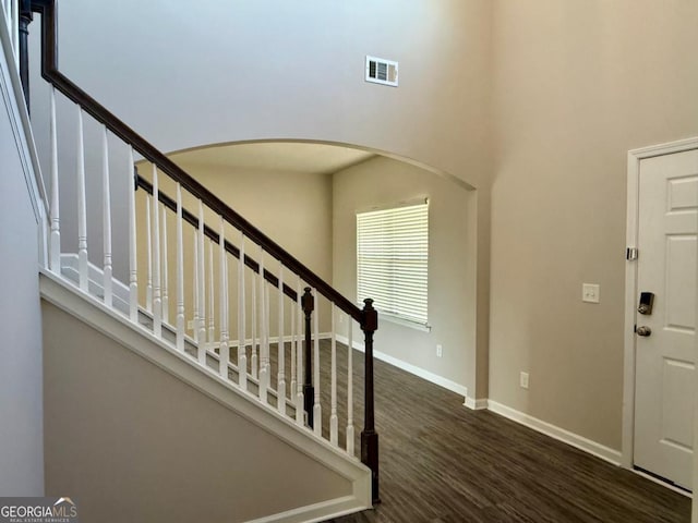 121 Birch River Ct, Dallas, GA 30132 - foyer featuring arched walkways, visible vents, wood finished floors, stairs, and baseboards