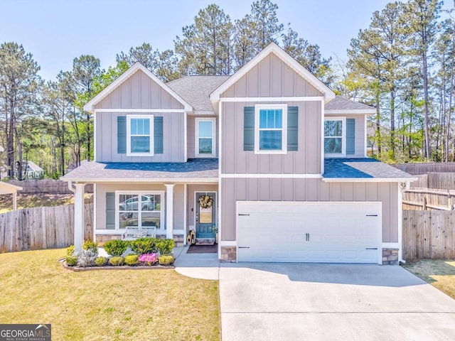 1302 Gardenia Ct, Villa Rica, GA 30180 - craftsman house with board and batten siding, fence, stone siding, and a front lawn