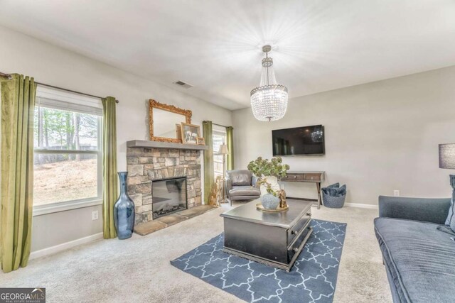1302 Gardenia Ct, Villa Rica, GA 30180 - living room featuring visible vents, baseboards, an inviting chandelier, carpet, and a fireplace