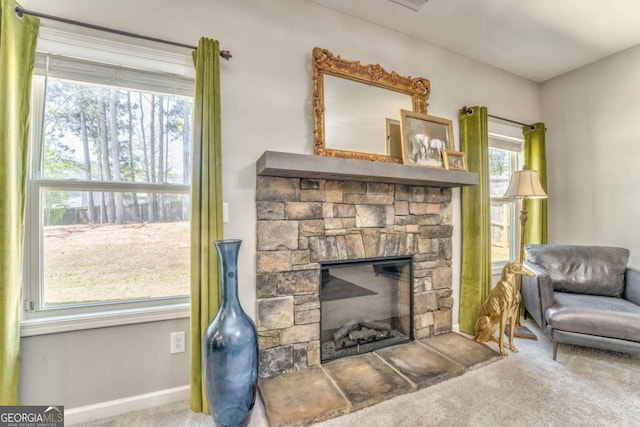 1302 Gardenia Ct, Villa Rica, GA 30180 - sitting room featuring a stone fireplace and carpet flooring