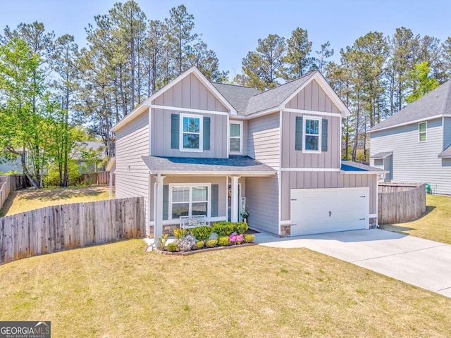 1302 Gardenia Ct, Villa Rica, GA 30180 - view of front facade with board and batten siding, driveway, fence, and a garage