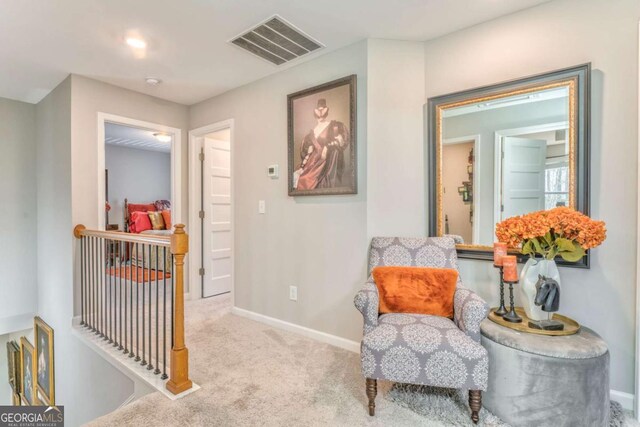1302 Gardenia Ct, Villa Rica, GA 30180 - sitting room with an upstairs landing, baseboards, carpet, and visible vents