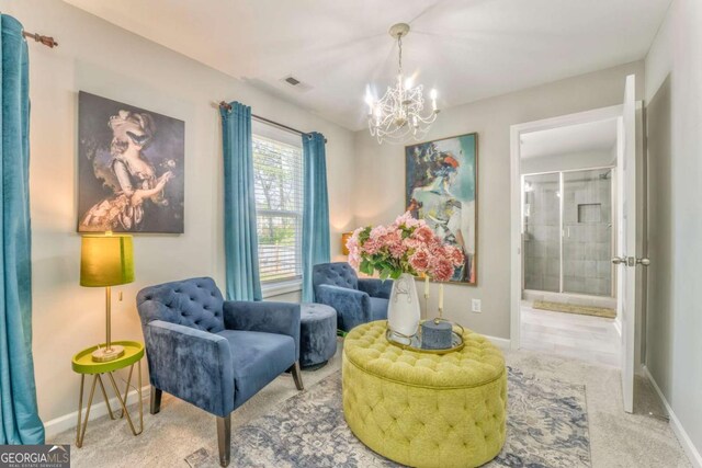 1302 Gardenia Ct, Villa Rica, GA 30180 - living area featuring a chandelier, baseboards, carpet, and visible vents