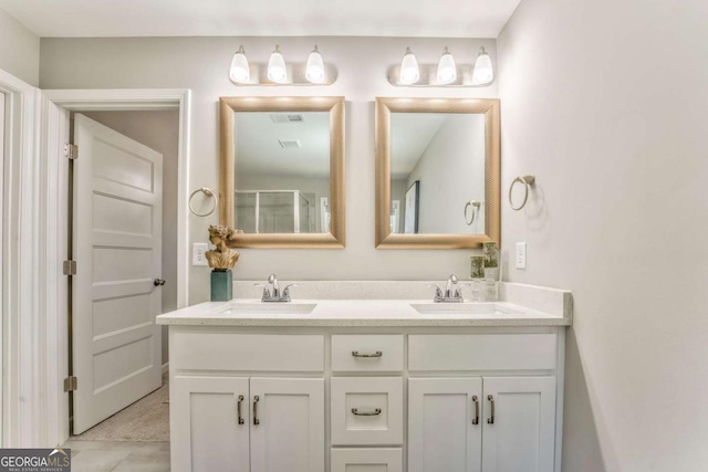 1302 Gardenia Ct, Villa Rica, GA 30180 - bathroom with a sink, visible vents, and double vanity