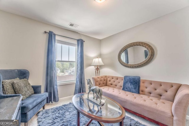 1302 Gardenia Ct, Villa Rica, GA 30180 - carpeted living room with visible vents and baseboards