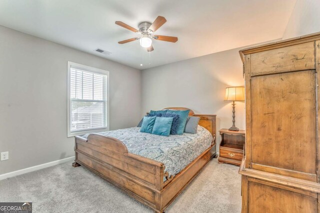 1302 Gardenia Ct, Villa Rica, GA 30180 - bedroom featuring visible vents, light colored carpet, baseboards, and ceiling fan