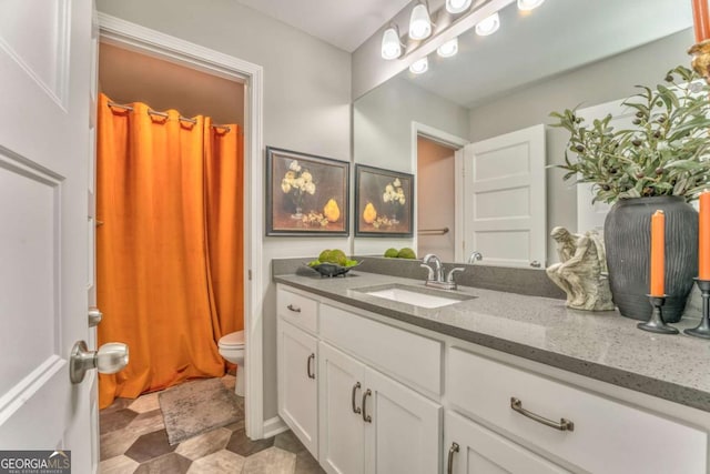 1302 Gardenia Ct, Villa Rica, GA 30180 - bathroom with vanity and toilet
