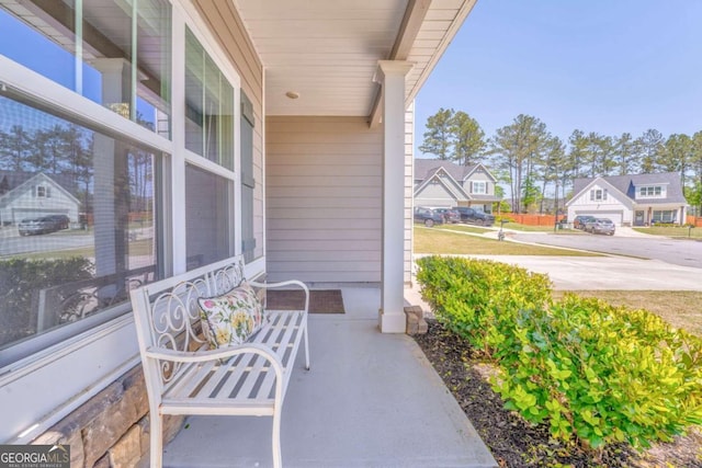 1302 Gardenia Ct, Villa Rica, GA 30180 - view of patio / terrace with covered porch and a residential view