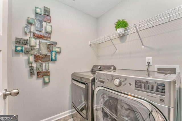 1302 Gardenia Ct, Villa Rica, GA 30180 - laundry area featuring washer and clothes dryer, laundry area, and baseboards
