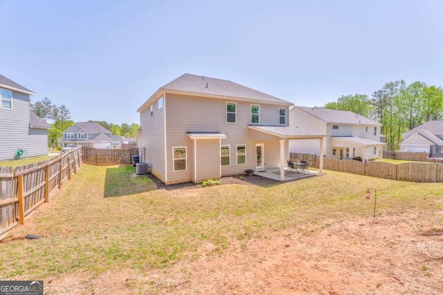 1302 Gardenia Ct, Villa Rica, GA 30180 - back of house with a patio area, a fenced backyard, central AC unit, and a lawn