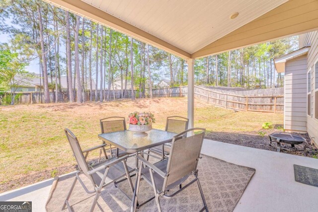 1302 Gardenia Ct, Villa Rica, GA 30180 - view of patio / terrace featuring outdoor dining space and a fenced backyard