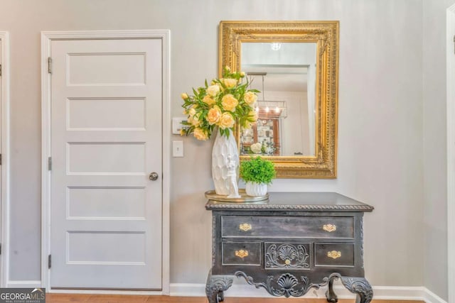 1302 Gardenia Ct, Villa Rica, GA 30180 - entryway with baseboards and a chandelier