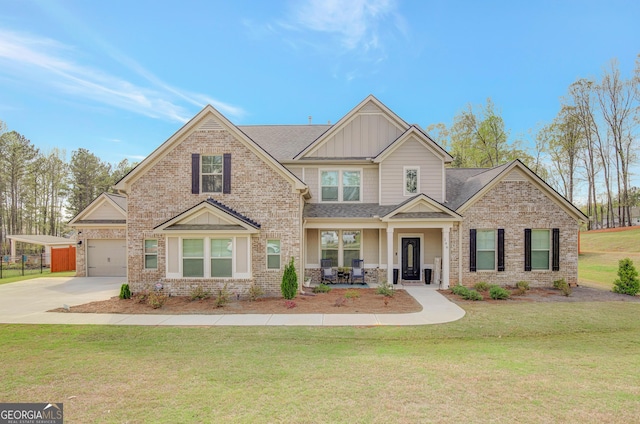 196 Saddleridge Trl, Senoia, GA 30276 - craftsman-style house with driveway, board and batten siding, a front yard, brick siding, and a porch