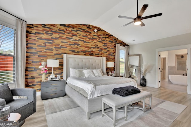 196 Saddleridge Trl, Senoia, GA 30276 - bedroom with light wood-type flooring, ensuite bath, a ceiling fan, lofted ceiling, and baseboards