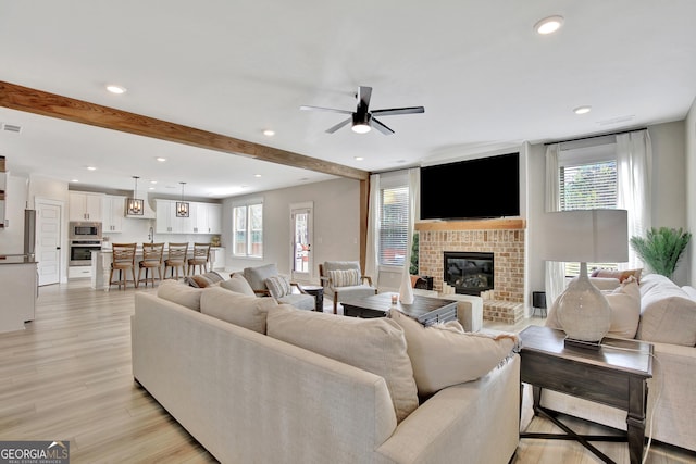 196 Saddleridge Trl, Senoia, GA 30276 - living room featuring recessed lighting, a fireplace, ceiling fan, and a healthy amount of sunlight