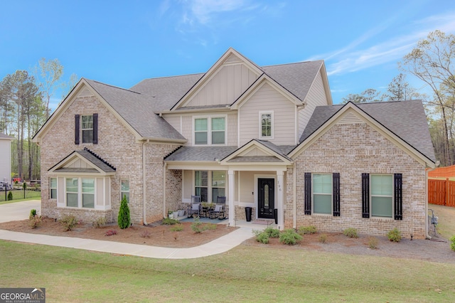 196 Saddleridge Trl, Senoia, GA 30276 - craftsman-style home with board and batten siding, a shingled roof, and brick siding