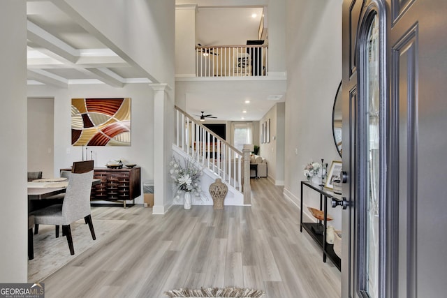 196 Saddleridge Trl, Senoia, GA 30276 - entryway with beamed ceiling, stairway, a high ceiling, wood finished floors, and baseboards