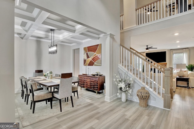 196 Saddleridge Trl, Senoia, GA 30276 - dining area with ceiling fan, light wood-style floors, beamed ceiling, stairs, and coffered ceiling