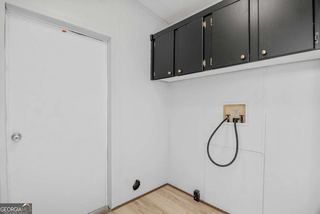 6603 Christie Cir, Blackshear, GA 31516 - washroom featuring cabinet space, light wood-style floors, and washer hookup