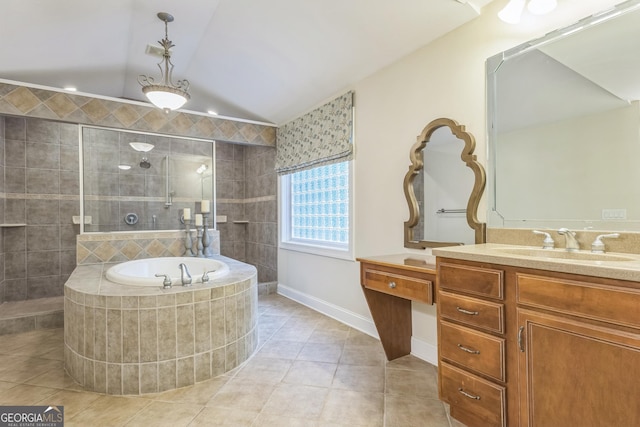 bathroom featuring a sink, a bath, a walk in shower, double vanity, and tile patterned flooring