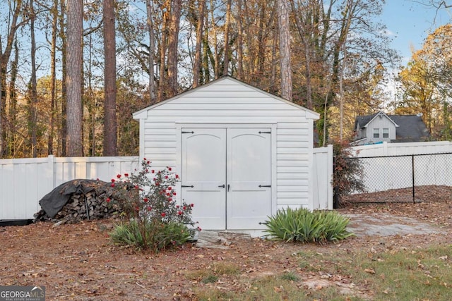 view of shed with fence