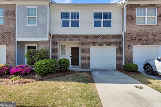 1929 Millstream Holw, Conyers, GA 30012 - multi unit property with a garage, brick siding, a front lawn, and concrete driveway