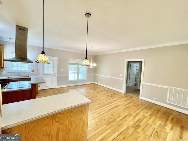 293 N Avery Rd NW, Rome, GA 30165 - kitchen featuring a sink, island range hood, visible vents, light wood-style floors, and a chandelier