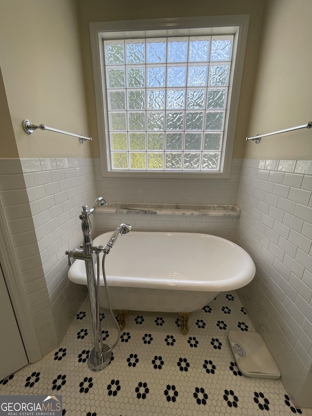 293 N Avery Rd NW, Rome, GA 30165 - full bath with tile walls, wainscoting, tile patterned flooring, and a freestanding tub