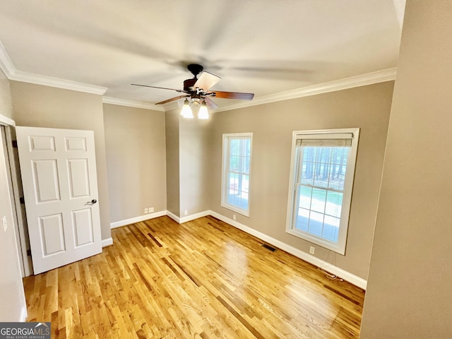 293 N Avery Rd NW, Rome, GA 30165 - unfurnished room featuring baseboards, visible vents, ceiling fan, crown molding, and wood finished floors