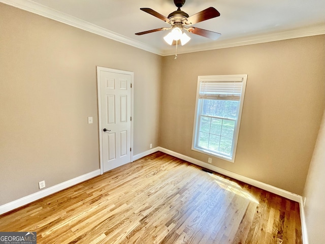 293 N Avery Rd NW, Rome, GA 30165 - spare room featuring baseboards, ornamental molding, ceiling fan, and wood finished floors