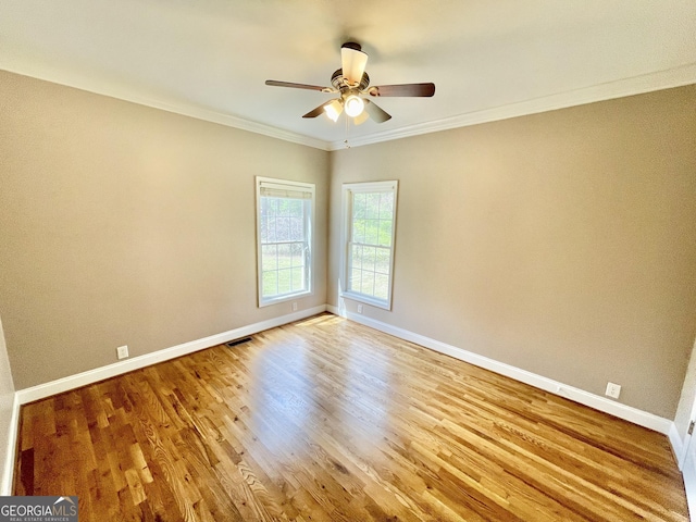 293 N Avery Rd NW, Rome, GA 30165 - spare room featuring wood finished floors, a ceiling fan, crown molding, visible vents, and baseboards