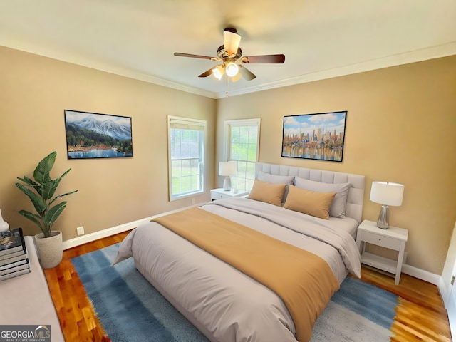 293 N Avery Rd NW, Rome, GA 30165 - bedroom with baseboards, ornamental molding, a ceiling fan, and wood finished floors