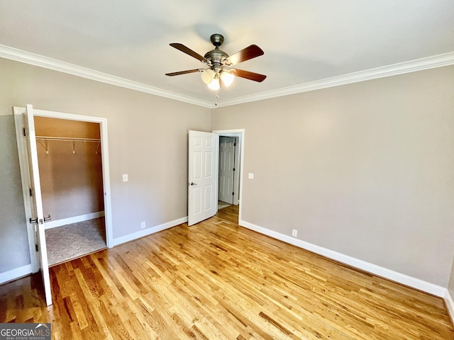 293 N Avery Rd NW, Rome, GA 30165 - unfurnished bedroom with ornamental molding, baseboards, light wood-type flooring, and a ceiling fan