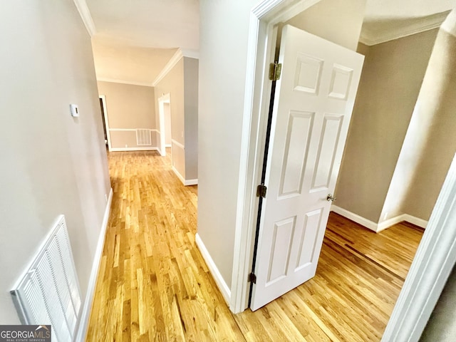 293 N Avery Rd NW, Rome, GA 30165 - corridor with an upstairs landing, visible vents, crown molding, light wood-style flooring, and baseboards