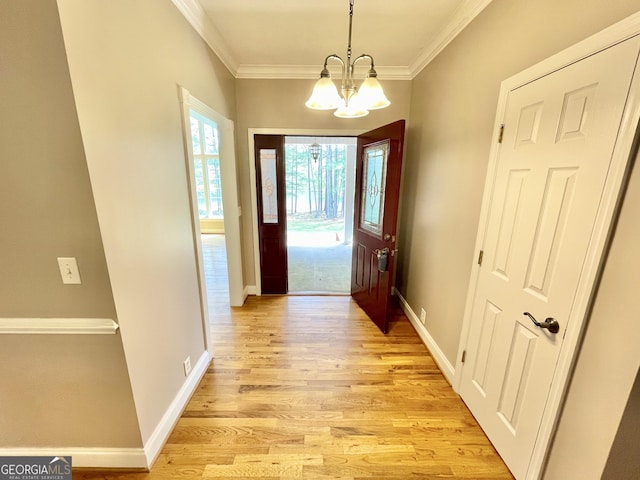 293 N Avery Rd NW, Rome, GA 30165 - doorway to outside with baseboards, crown molding, a chandelier, and light wood-type flooring