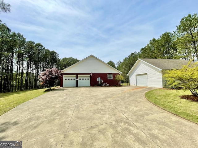 293 N Avery Rd NW, Rome, GA 30165 - view of property exterior with a yard, an outbuilding, and a detached garage