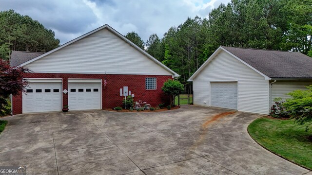 293 N Avery Rd NW, Rome, GA 30165 - view of side of property with driveway, brick siding, and an outdoor structure