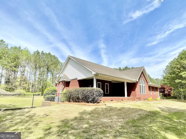 293 N Avery Rd NW, Rome, GA 30165 - view of side of home featuring a lawn, roof with shingles, brick siding, and fence