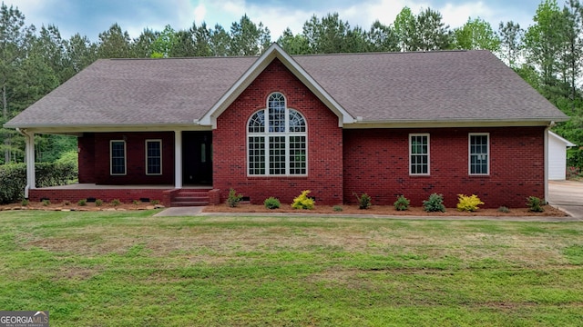 293 N Avery Rd NW, Rome, GA 30165 - ranch-style home featuring covered porch, a shingled roof, brick siding, and a front yard
