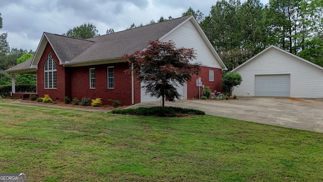 293 N Avery Rd NW, Rome, GA 30165 - view of home's exterior with a yard, roof with shingles, brick siding, and a detached garage