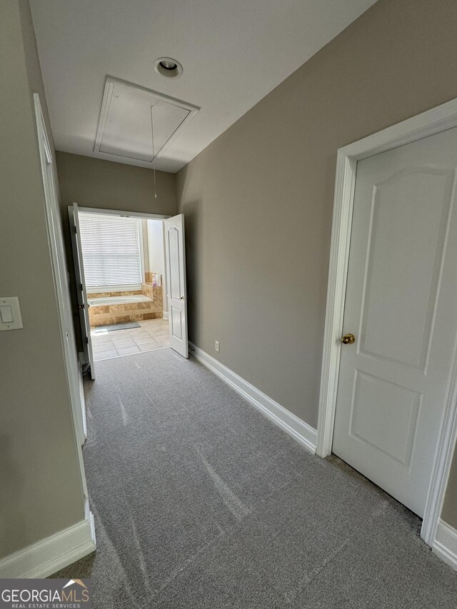 135 Danube Trl, Stockbridge, GA 30281 - interior space featuring baseboards and attic access