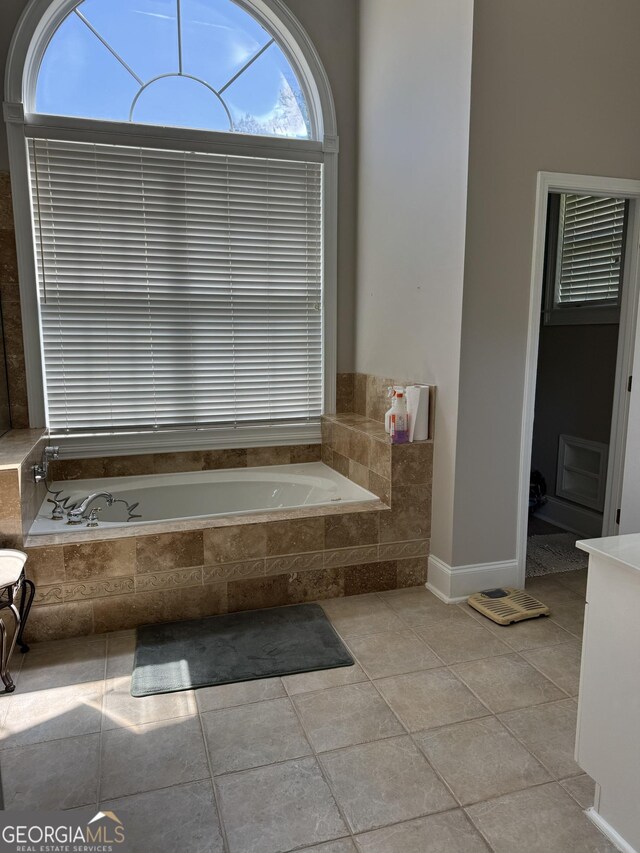 135 Danube Trl, Stockbridge, GA 30281 - full bath featuring tile patterned floors and a garden tub