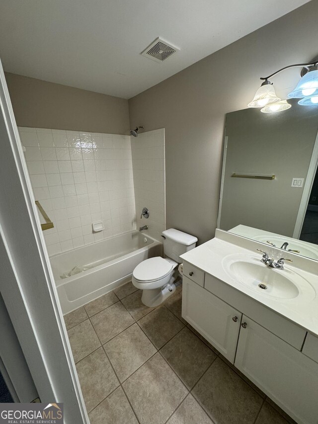 135 Danube Trl, Stockbridge, GA 30281 - bathroom with visible vents, toilet,  shower combination, vanity, and tile patterned floors